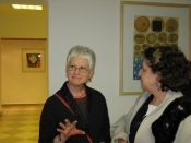 Thumbnail image of "Karen offers an explanation of her work to Egyptian collector"